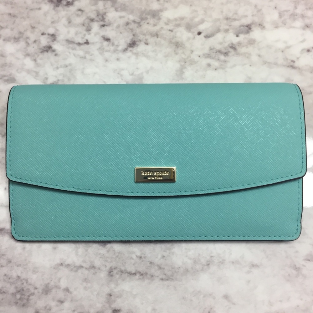 Free cosmetic bag w/purchase of Kate Spade wallet